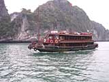 One of the many junks plying the waters loaded with tourists - note the dragon's head on the bow