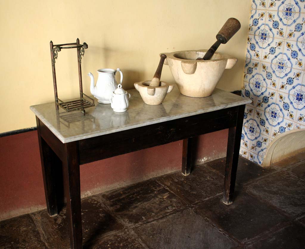 Kitchen table with pestles and mortars.