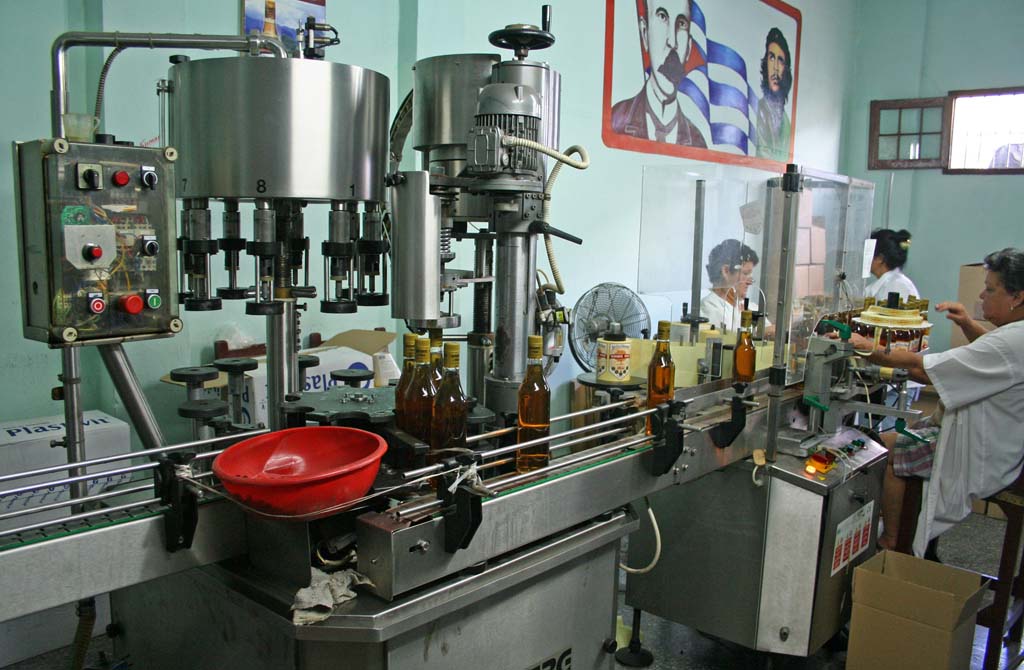 Labelling the bottles at the rum factory.