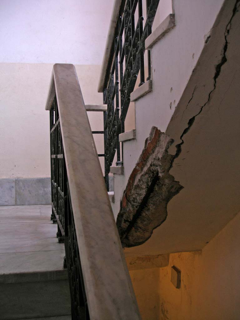 On the stairs near the top.