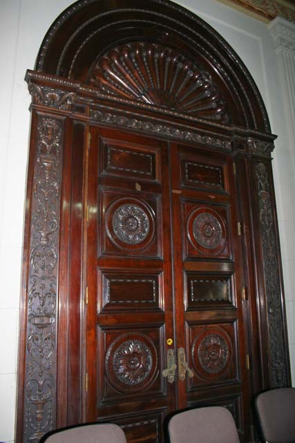 A door at the back of a conference room.