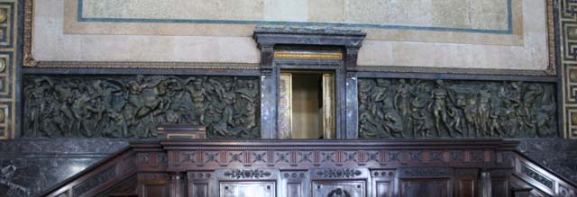 Bronze by Gianni Remussi representing war (L) and workers (R).