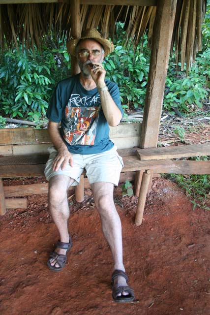 Chris samples a cigar that's just been rolled for us.