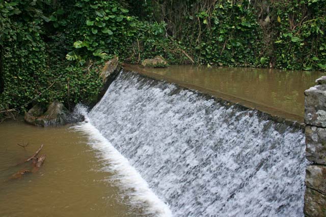 After we emerged,the boat had to stop short of this weir .