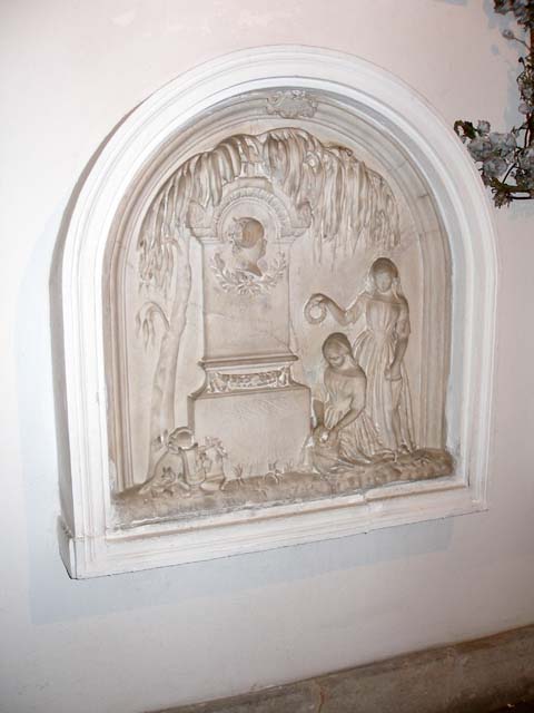 One of a collection of marble tombstones.